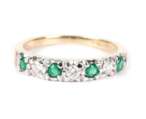 An emerald and diamond half-hoop eternity ring, set with circular-facet cut emeralds and brilliant cut diamonds, 18ct yellow 