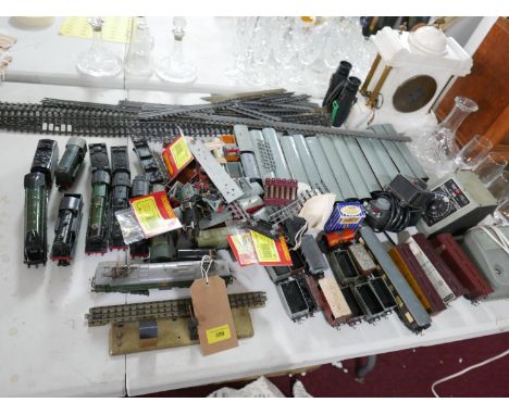 A collection of vintage Hornby trains to include 7 locomotives, 12 long carriages and various accessories 