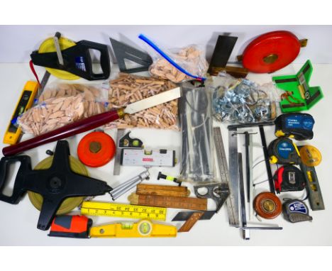 A collection of various measures / levels, a Record Power chisel, dowels and other. [W]