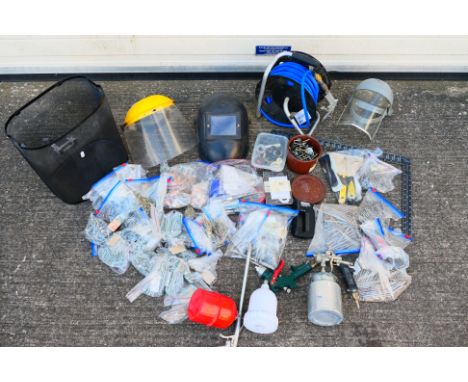 Lot to include a Parkside air hose reel with attached gun, further spray gun, masks, various screws, measure and similar. [2]