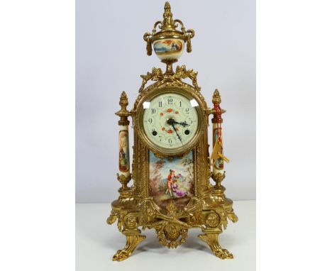 Franz Hermle 19th century style gilt metal and porcelain mantel clock, with key, approximately 41 cm (h). [W]