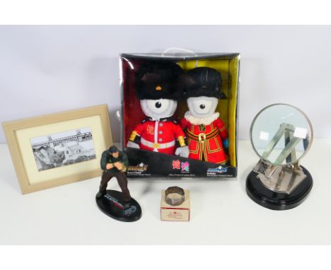 Lot to include a Watts & Sons Ltd desktop magnifier, silver napkin ring, Splinter Cell figure, London 2012 Olympics soft toy 