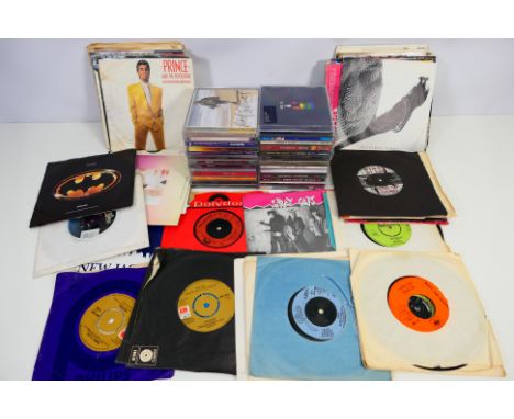 A collection of 7" vinyl records and compact discs to include The Beatles, Status Quo, Prince, David Bowie, Level 42, Queen a