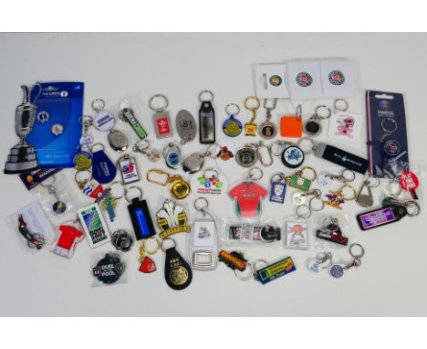Sporting Keyrings, A bag of 56 sporting keyrings covering Football, Rugby, Hockey, Motor racing etc sold with Roland Garros w
