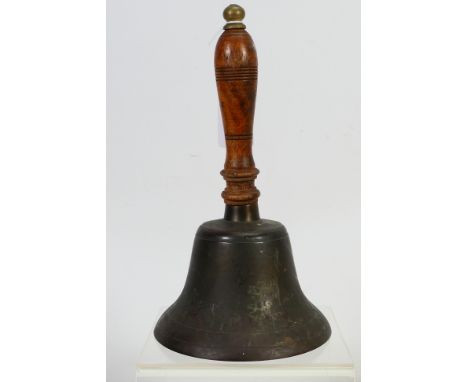 A small hand bell with turned wooden handle. [W]