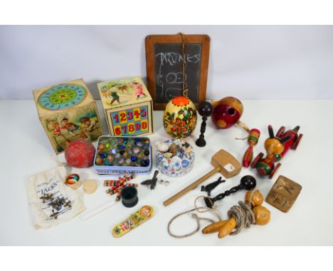 A collection of vintage toys and similar to include marbles, spinning top, jacks, skipping rope and other. [W]