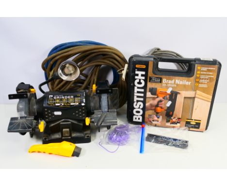 A 230 volt 150mm bench grinder, model CLM150BG with work light and a Stanley Bostitch Brad Nailer SB-1850BN. [2]. [W]
