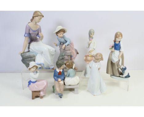 A collection of Nao and similar figures / groups, predominantly depicting children and young girls, largest approximately 29 