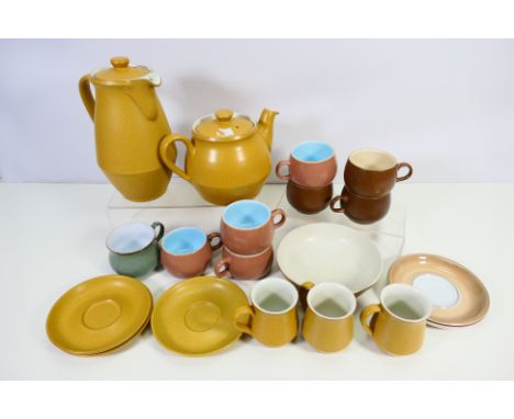 Denby - A mixed lot of Denby to include: 'Ode' mustard coloured coffee & tea pots, three mugs and saucers and one bowl (some 