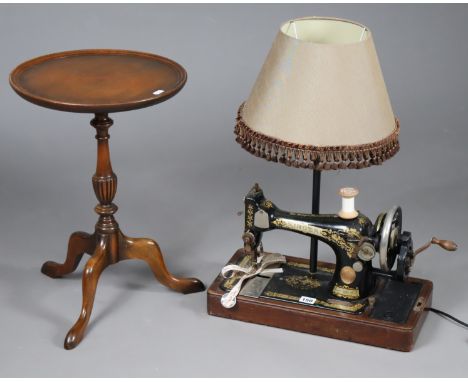 A Singer sewing machine converted to a table lamp, with shade; &amp; a mahogany wine table.