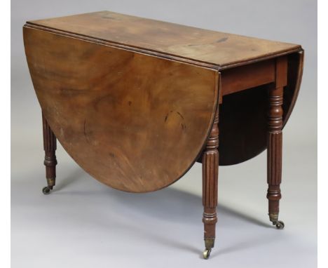 An early/mid-19th century drop-leaf table with gate-leg supports and D-shaped ends, on turned and reeded legs with brass cast