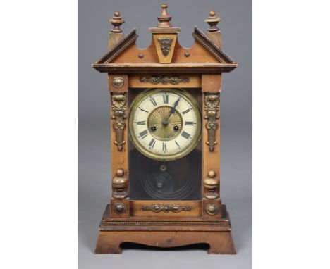 A late 19th century mantel clock with black Roman numerals to the two-part dial, in a beech case with gilt-metal mounts, 47.5