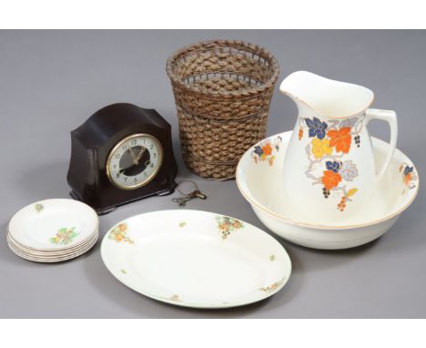 A Smith’s Enfield mantel clock in a Bakelite case; a floral decorated toilet jug &amp; bowl; a waste-paper pail; &amp; a fire