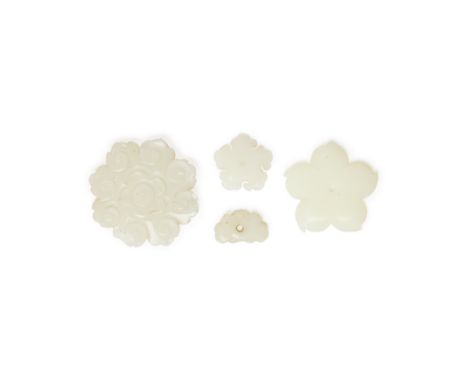 Four Chinese white jade 'flower' ornamentsQing dynasty, 18th centuryComprising a large flower button, carved to the front wit