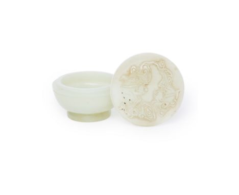 A small Chinese pale jade circular box and coverQing dynasty, 18th/19th centuryThe cover carved in shallow relief with a pair