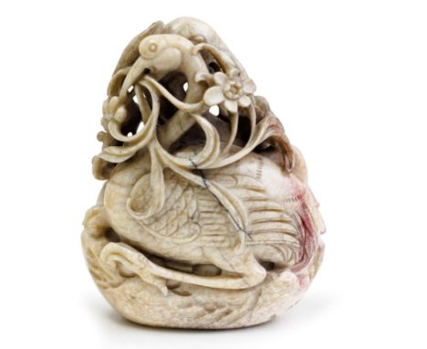 A Chinese mottled chicken-bone, black and russet jade carving of a deer and phoenixMing/Qing dynasty, 17th centuryCarved and 