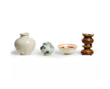 A group of four Chinese ceramic vesselsFive dynasties - 20th centuryComprising a white-glazed jar, Five dynasties, 10cm high,