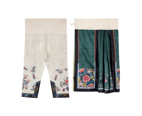 A Chinese emerald green silk embroidered apron skirt and a pair of Chinese cream silk embroidered trousers Late Qing dynastyT