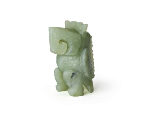 A Chinese archaistic green jade standing parrot20th centuryWith stylised scrolling angular motifs throughout, box, 8cm high.P