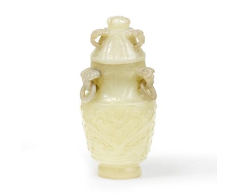 A Chinese celadon jade 'taotie' vase and coverQing dynasty, 19th centuryOf cylindrical form, carved to the body with two taot