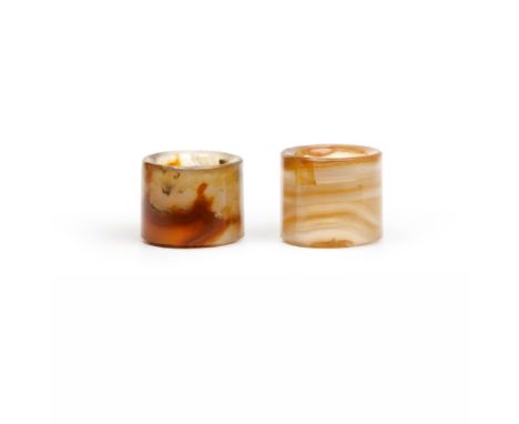 Two Chinese agate archer's ringsQing dynastyThe first with light brown banded inclusion, 2.2cm diameter, 3.3cm outer diameter
