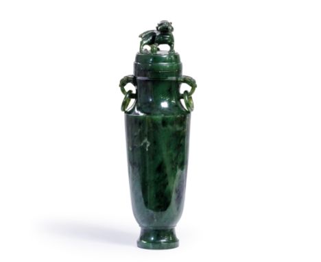 A Chinese spinach jade vase and coverLate Qing dynastyOf slender tapering form, the cover carved with Buddhist lion finial, t