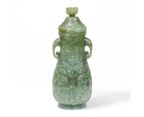 A Chinese jade archaistic twin-handled pear-shaped bottle vase and coverQing dynasty, 18th/19th centuryThe semi-translucent, 