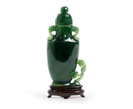 A small Chinese spinach jade 'lingzhi' vase and coverMid Qing dynastyThe even, dark green stone carved and pierced as a flatt