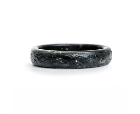 A Chinese spinach green jade archaistic 'chilong' bangle Qing dynastyThe bangle carved in low relief with five chilongs on cr