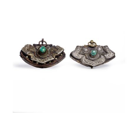 Two Tibetan silver mounted leather pouches18th/19th CenturyComprising a pouch mounted with two domed silver flowers above lar