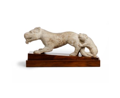 A large Chinese Tang-style carved marble figure of a mother tigerLate Qing dynastyCarved striding forward with a cub standing