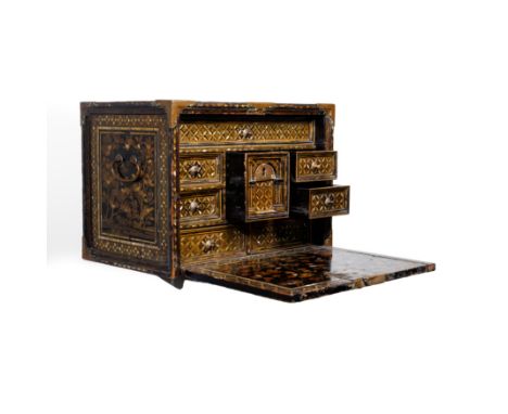 A Japanese Namban black lacquered, mother of pearl inlaid and gilt decorated cabinetMomoyama period, early 17th centuryThe fa