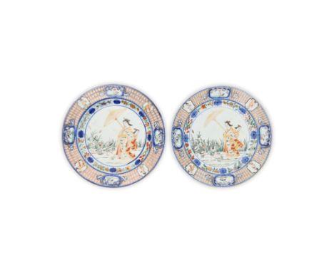 A pair of Japanese Imari-ware 'La Dame au Parasol' platesEdo periodEach painted in underglaze blue and enamelled and gilt to 