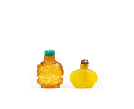 A Chinese carved amber glass 'zodiac animals' snuff bottle and a carved yellow glass 'elephant' snuff bottleLate Qing dynasty