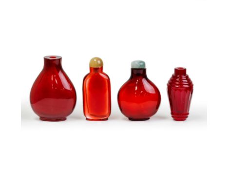 Four Chinese ruby glass snuff bottlesLate Qing dynasty/Republic periodComprising: two pear-shaped bottles, 7.3cm and 6cm high