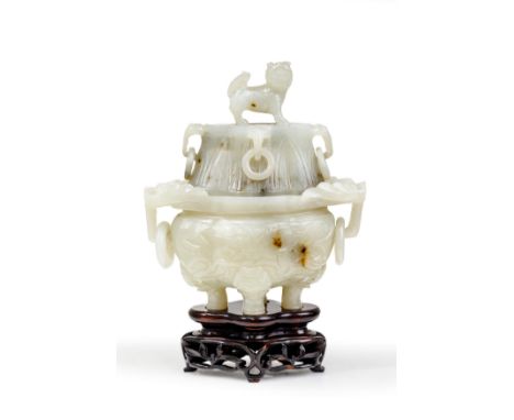 A Chinese carved jade twin handled incense burner and coverLate Qing DynastyOf flattened lobed shape, standing on four animal