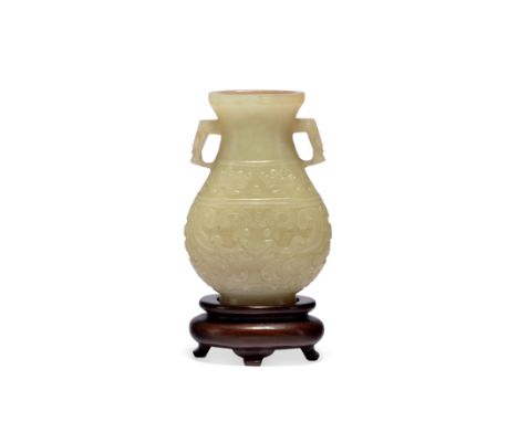 A Chinese russet-celadon jade vase, huMing/Qing dynasty, 17th centuryThe weighty vessel of flattened form, carved to the fron