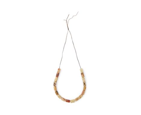 Eighteen Chinese carved jade and hard stone beads, congFirst half of 20th centuryOf rectangular form, carved to each side wit