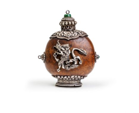 A Chinese Mongolian-style mounted pod 'dragon and Garuda' snuff bottleQing dynasty, 1770-1900The sea pod mounted at the foot 