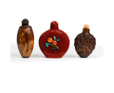 A Chinese hardstone inlaid cinnabar lacquer snuff bottle and two coconut snuff bottles20th centuryThe first with a pink tourm