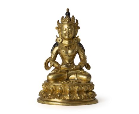 A Sino-Tibetan gilt bronze Bodhisattva18th centuryThe heavily casted figure seated on a waisted lotus throne in Padmasana wit