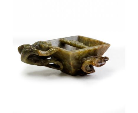 A Chinese green and russet jade 'chilong and lingzhi' rice grain measureLate Ming/early Qing dynasty, 17th centuryThe flared 