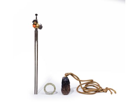 A Chinese black and celadon jade pendant, a hardstone ring, and a parcel-gilt coral-mounted 'Buddhist lions' hairpinMing - Qi