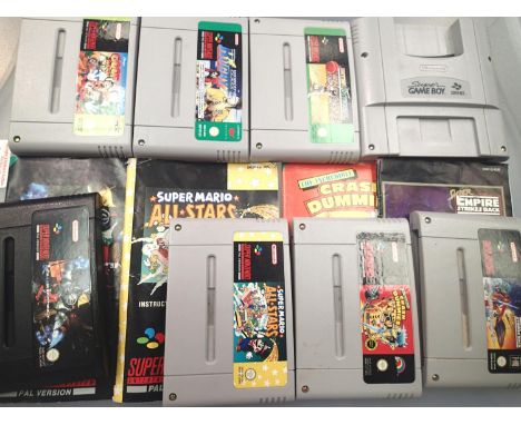 Seven Super Nintendo SNES game cartridges, including Empire Strikes Back, Super Mario All stars, Killer Instinct etc. All wit