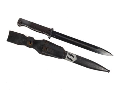 A WWII period German K98 bayonet with "asw" maker's code, the hilt with bakelite grips, in its painted scabbard with silver "