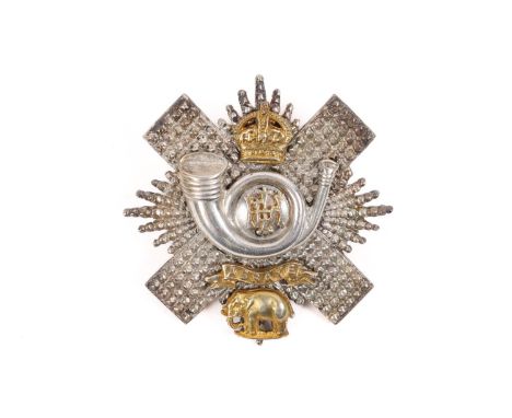 An officer's post 1902 silver coloured glengarry badge of the Highland Light Infantry, with gilt mounts and bearing the mark 