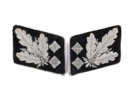 A Third Reich pair of collar patches to a senior SS officer, alloy bullion embroidery on black velvet, VGC £300-350