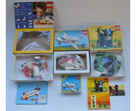Three boxed vintage Lego sets, Light &amp; Sound System Helicopter set 6482, Business Jet set 6368 and Forestmen's Hideout se