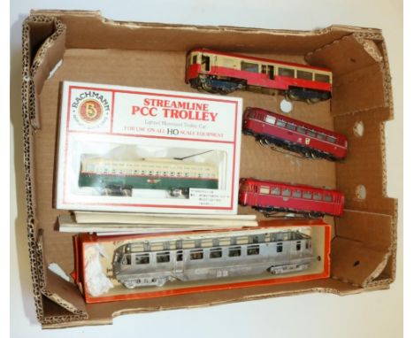 Bachmann HO gauge streamline PCC trolley car, 2 Macklin 3 rail trolley buses, scratch built white metal OO gauge GWR diesel r