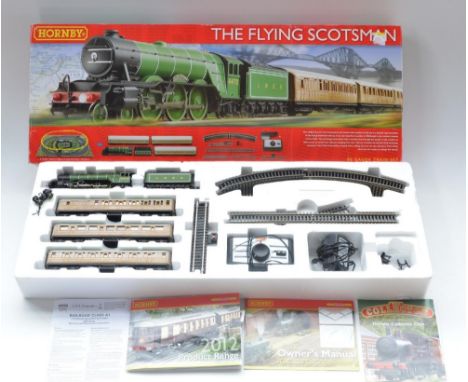 Boxed Hornby HO gauge Flying Scotsman electric train set. Engine front bogie is disconnected, the locating screw is missing a